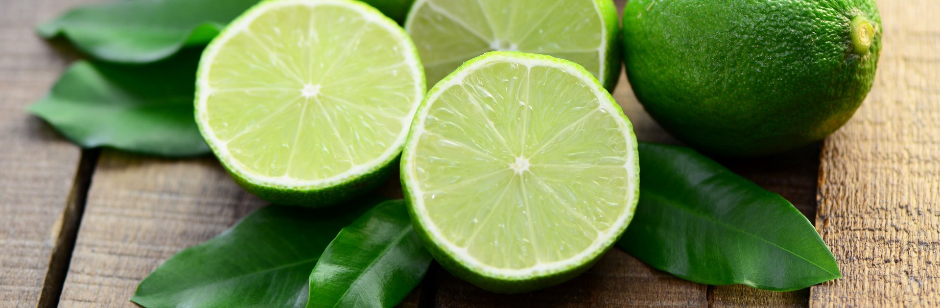 Fresh limes lie on a table